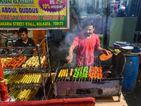 People are barbecuing various meats known as ''Kabab'' for sale ahead of Iftar at a marketplace during the month of Ramadan in Kolkata, Indi...
