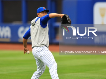 Jose Quintana, #62 of the New York Mets, is throwing in the outfield during workouts at Citi Field in Corona, New York, on March 26, 2024. (