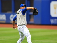 Jose Quintana, #62 of the New York Mets, is throwing in the outfield during workouts at Citi Field in Corona, New York, on March 26, 2024. (