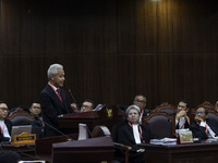 Presidential candidate Ganjar Pranowo is speaking during the first hearing of the petition lawsuit concerning the presidential election held...