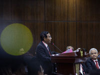Vice Presidential candidate Mahfud MD is speaking during the first hearing of the petition lawsuit concerning the presidential election held...
