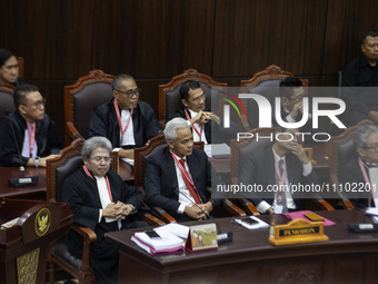 Presidential candidate Ganjar Pranowo (2nd L) and Vice Presidential candidate Mahfud MD (2nd R) are attending the first hearing of a petitio...