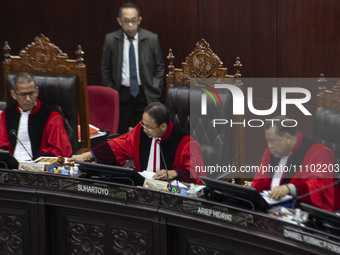 Chief Justice of the Indonesian Constitutional Court, Suhartoyo, is banging the gavel to close the first hearing of the petition lawsuit ove...