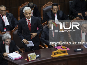 Presidential candidate Ganjar Pranowo (2nd L) is reacting after the first hearing of the petition lawsuit over the February 14 presidential...