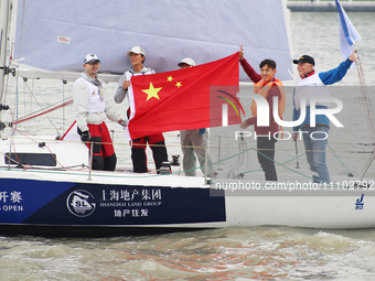 Wang Shenchao, a player for Shanghai Port Football Club, is participating as the ''captain'' of the J80 Sailing boat during the 2024 Shangha...