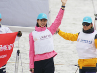 Olympic Sailing champion Xu Lijia is participating in a parade along the Huangpu River as the ''captain'' of the J80 boat during the 2024 Sh...