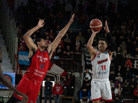Davide Moretti of Itelyum Varese and Ahmet Safa Yilmaz of Bahcesehir Sport Club are competing during the FIBA Europe Cup match between Openj...