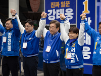Lee Jae-myung, the leader of the Democratic Party of Korea, is raising his hand in greeting from the podium during the Democratic Party of K...