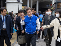 Lee Jae-myung, the leader of the Democratic Party of Korea and the standing co-chairman of the election campaign committee, is exiting after...