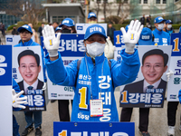 Election campaigners from the Democratic Party of Korea are greeting citizens at the campaign kickoff in front of Yongsan Station Square in...