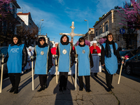 Women are participating in the procession of the Eight Saints in Ruvo di Puglia, Italy, on Holy Thursday, March 28, 2024. The procession is...