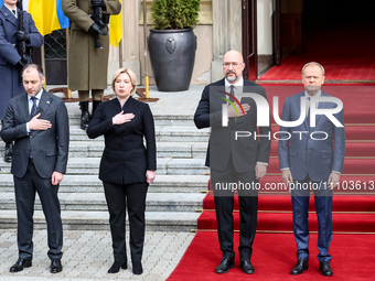 Prime Minister of Poland, Donald Tusk (R) greets Prime Minister of Ukraine, Denys Shmyhal (second right) as Ukrainian delegation visits Pola...