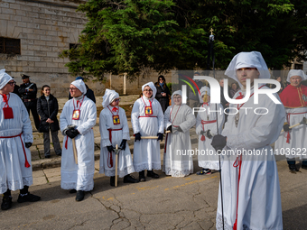 Brethren are participating in the procession of the Eight Saints in Ruvo di Puglia, Italy, on Holy Thursday, March 28, 2024. The procession...