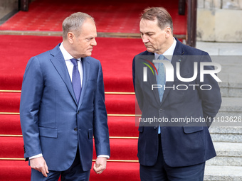 Prime Minister of Poland, Donald Tusk (L), and and Minister of Foreign Affairs of Poland, Radoslaw Sikorsk (R) await an arrival of the Prime...