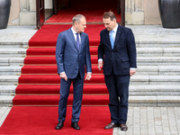 Prime Minister of Poland, Donald Tusk (L), and and Minister of Foreign Affairs of Poland, Radoslaw Sikorsk (R) await an arrival of the Prime...