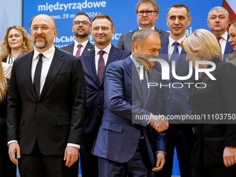 Prime Minister of Poland, Donald Tusk and Vice Prime Minister of Ukraine, Iryna Vereshchuk talk during a family photo as Ukrainian delegatio...