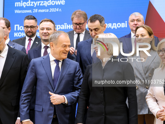 Prime Minister of Poland, Donald Tusk and Vice Prime Minister of Ukraine, Iryna Vereshchuk talk during a family photo as Ukrainian delegatio...