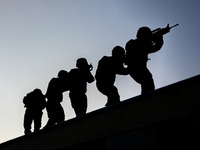 SWAT team members are conducting a search and pursuit drill in Beihai, China, on March 28, 2024. (