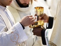 Holy Communion during the Chrism Mass at Saint Peter's Basilica in Vatican on March 28, 2024. (