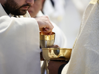 Holy Communion during the Chrism Mass at Saint Peter's Basilica in Vatican on March 28, 2024. (
