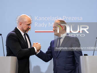 Prime Minister of Poland, Donald Tusk (R) and Prime Minister of Ukraine, Denys Shmyhal shake hands during a press conference during bilatera...