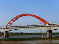 A Smart Fuxing bullet train is running on the Xinjiang West Branch Extra Large Bridge in Shangrao, Jiangxi Province, China, on March 28, 202...