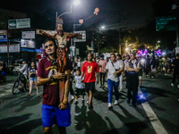 Mark, 35, is carrying a cross while walking towards the International Shrine of Our Lady of Peace and Good Voyage in Antipolo City, Philippi...