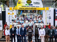 A family is posing for a photo during the ceremonial start of the FIA World Rally Championship WRC Safari Rally Kenya 2024 in Naivasha, Keny...