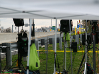 The collapsed Francis Scott Key Bridge is seen through a media staging area at the Maryland Tansportation Authority headquarters in Dundalk,...