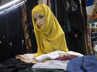 A mannequin is being covered with a mandatory headscarf during the Hijab and Chastity fair at the Imam Khomeini Grand Mosque in downtown Teh...