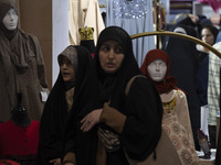 Veiled Iranian women are walking past mannequins with mandatory headscarves at the Hijab and Chastity fair in the Imam Khomeini Grand Mosque...