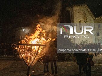 Afire in a square is seen during Good Friday procession in Gubbio, Italy, on March 29th, 2024. The Dead Christ procession on Good Friday is...