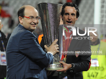 Head Coach Unai Emery of Sevilla and Sevilla president, Jose Castro celebrate with the trophy at the end of the UEFA Europa League final foo...