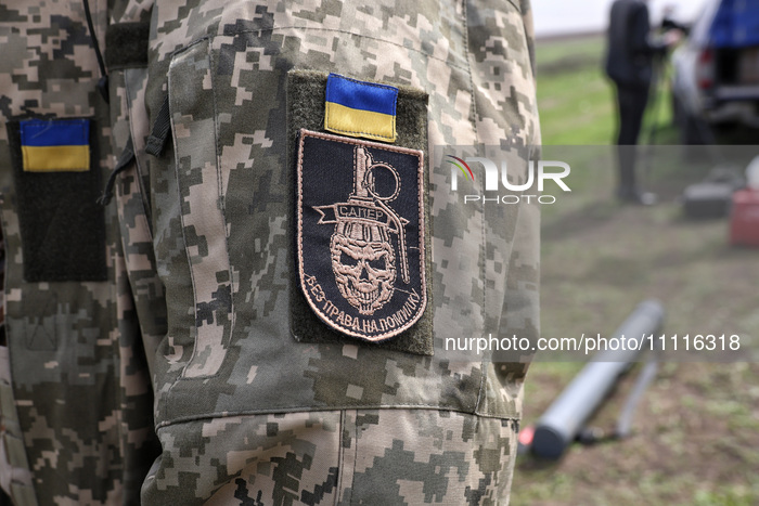 A chevron is being seen on a soldier's uniform during the field tests of the MinesEye unmanned system for the detection of mines and explosi...