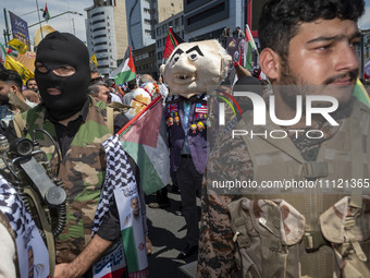 Islamic Revolutionary Guard Corps (IRGC) military personnel are walking with an effigy of Israeli Prime Minister Benjamin Netanyahu during a...