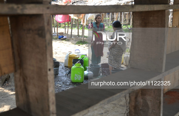 Indian women’s collect drinking water from a supply line on the World Water Day in Dimapur, India north eastern state of Nagaland on Tuesday...