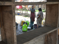 Indian women’s collect drinking water from a supply line on the World Water Day in Dimapur, India north eastern state of Nagaland on Tuesday...