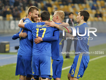 Andriy Yarmolenko (L) and players of Ukraine national football team celebrate a goal,during the friendly football match between Ukraine and...