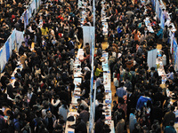 Chinese graduating students  enter a special job fair for 2016 college graduates at the University of Harbin, Heilongjiang province, China o...