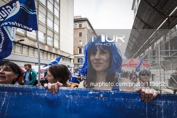 Rome, Italy – May 17, 2014: A woman with a drop of water painted on her face takes part at a nationwide demonstration against the privatizat...