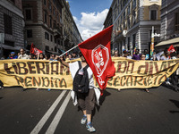 Rome, Italy – May 17, 2014: Protesters march during a nationwide demonstration against the privatization of the commons and the austerity po...