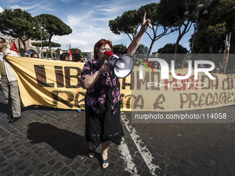 Rome, Italy – May 17, 2014: Protester shouts slogan during a nationwide demonstration against the privatization of the commons and the auste...