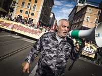 Rome, Italy – May 17, 2014: Protester shouts slogan during a nationwide demonstration against the privatization of the commons and the auste...