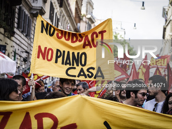 Rome, Italy – May 17, 2014: Protesters shout slogans during a nationwide demonstration against the privatization of the commons and the aust...