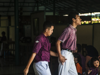 Two student walk in special school childern for physical disabilities in Special School PRI, Pekalongan, Central Java, Indonesia, on April 6...