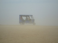 An electronic rickshaw ,carring passengers, moves towards holy sangam, in a dust storm,during a hot day, in Allahabad on April 7,2016. (