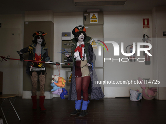 Cosplayers, Elena, middle and Belen, left get ready and prepare to participate in the Cosplay competition at the 