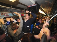 Kiev Metro fans celebrate after a victory over the Dnieper river Kiev bridge, beating Shakhtar Donetsk 2-1 (
