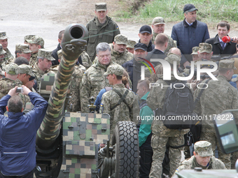 President Petro Poroshenko visits the artillery military unit in Kyiv region, April 27, 2016. (Photo by Sergii Kharchenko/NurPhoto)