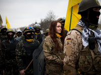 A anti-government protester woman take part in demonstration on Maidan square in Kiev on February 14, 2014. Russia will release the next ins...
